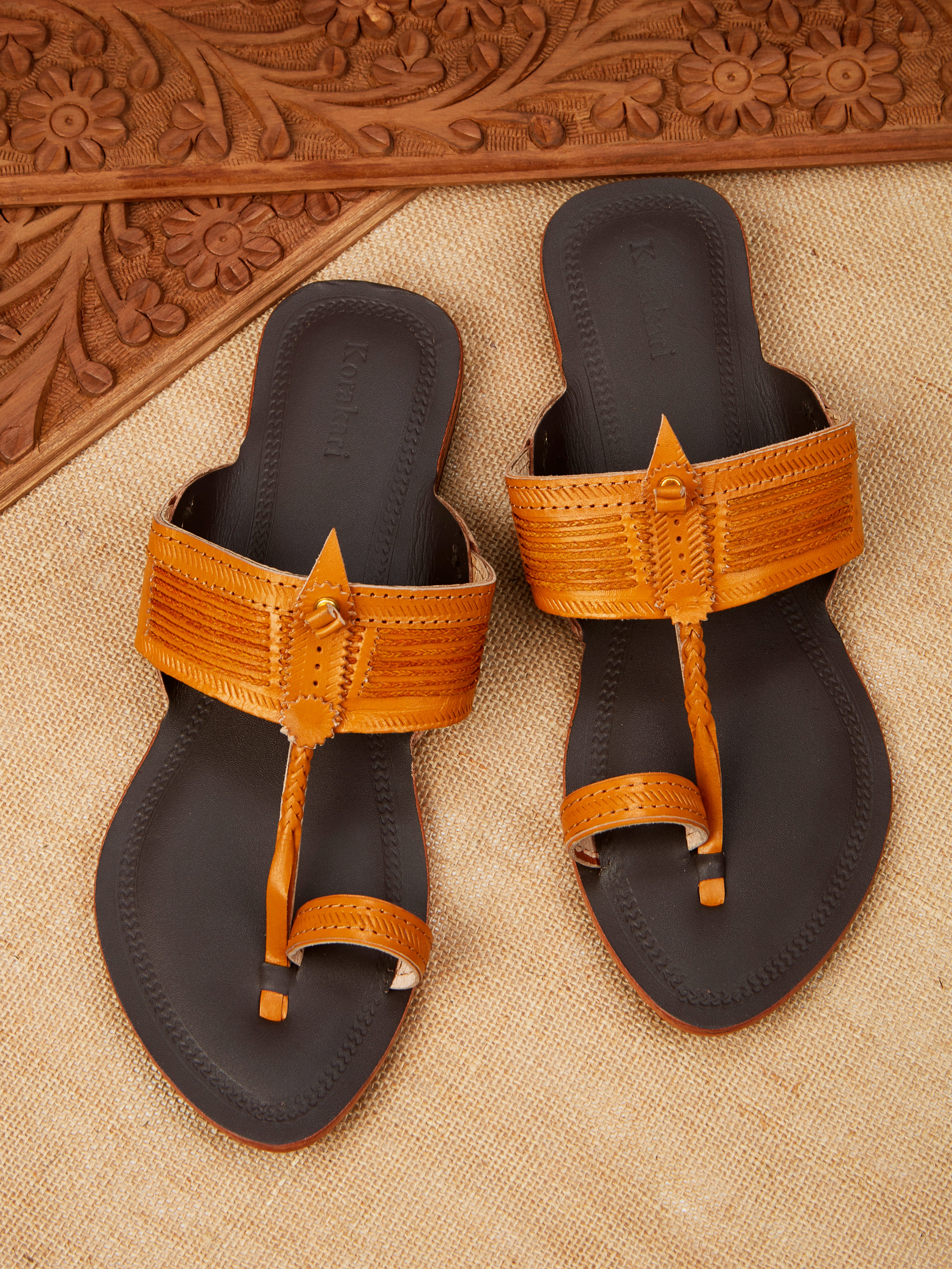 Woman In Elegant Dual Kolhapuri Chappal